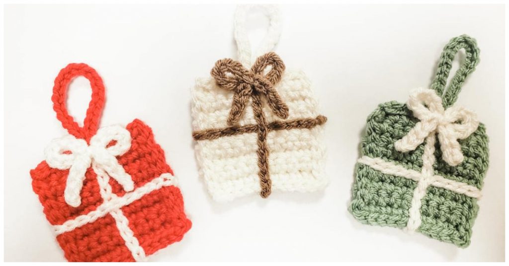 We are going to learn How to Crochet Free Christmas Present Ornament Patterns. This pattern works up quickly and is made up of just a few stitches. They are a fun and easy way to DIY home decor or decorate for Christmas on a budget. These ornaments also make for thoughtful gifts.
