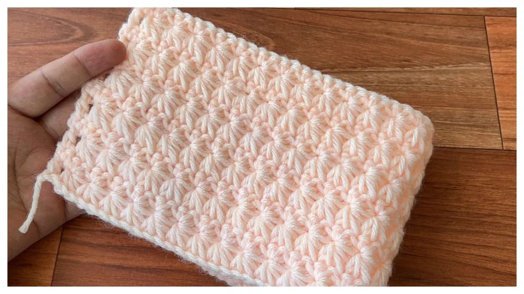 This crochet stitch pattern is worked over two rows and can be stacked or separated by rows. In the first row, you work the bottom half of the star by making clusters of 5 single crochet stitches worked together.