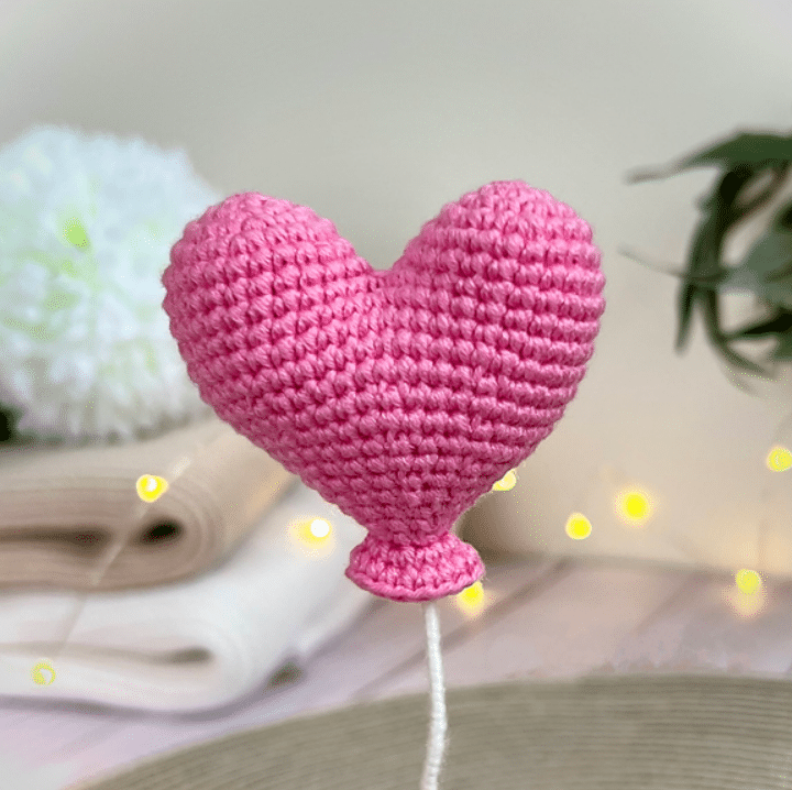 Crocheting a heart balloon is a fun and easy project that can be completed in just 1 hour. To start, you'll need a few basic crochet supplies including a crochet hook and some yarn in your desired color.